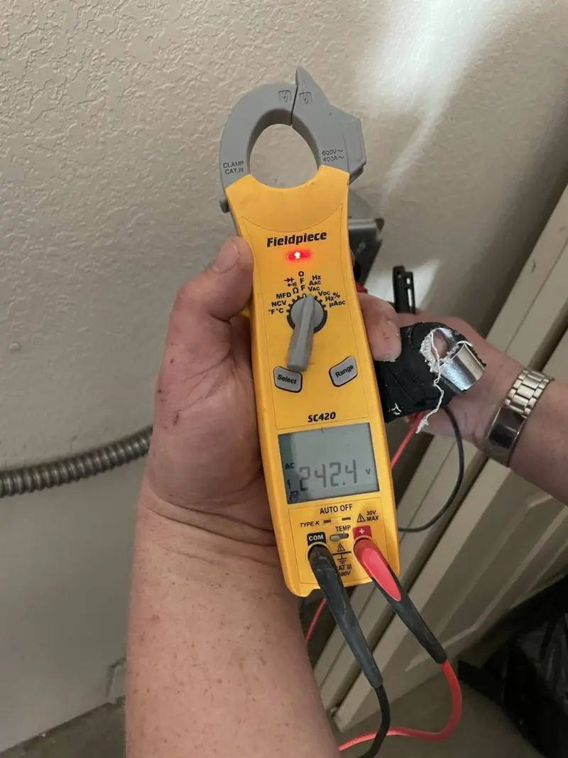 Voltage testing with clamp meter during Ceiling Fan Installation in Honey Brook